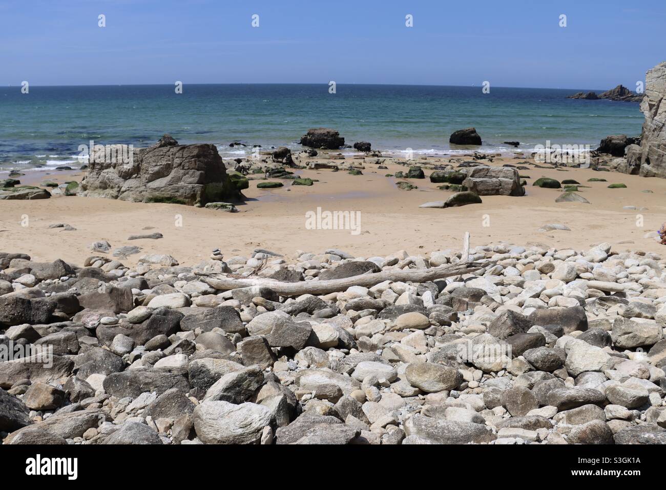 Stones and driftwood on the beach in Brittany - Smartphone Captured Stock Image