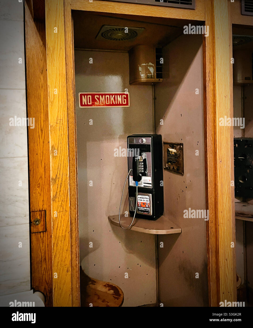 No smoking sign inside an old fashion payphone booth, NYC, USA - Smartphone Captured Stock Image