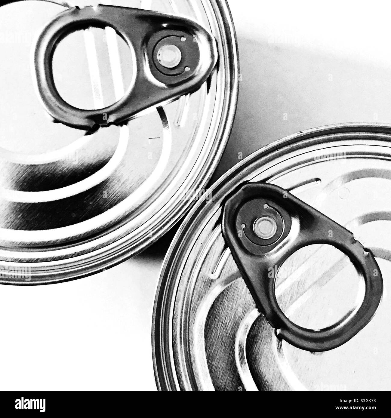 Ring pulls on canned food tins. Stock Photo