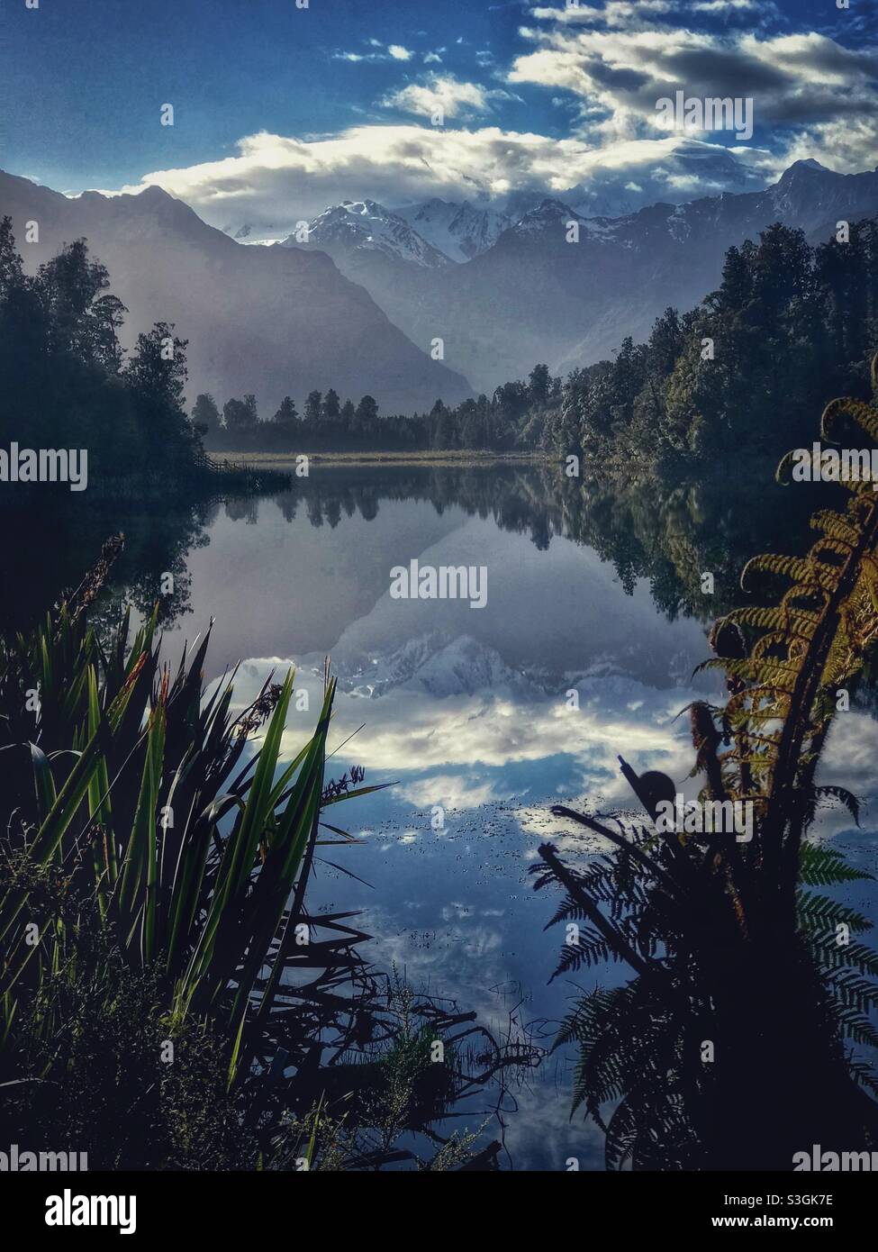 Vertical scenic view of Lake Matheson, South Island, New Zealand - Smartphone Captured Stock Image