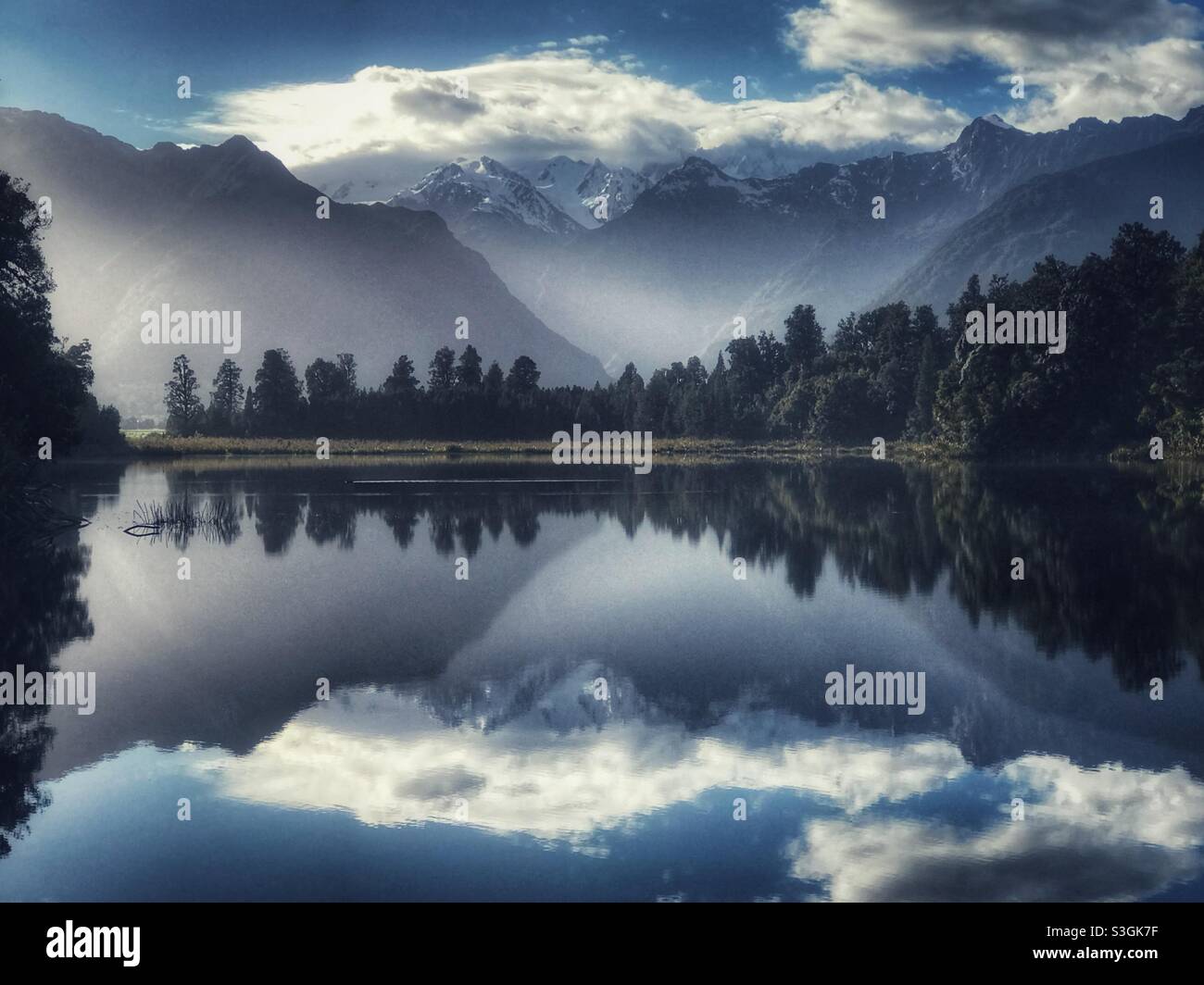 The Southern Alps reflected in Lake Matheson, South Island, New Zealand - Smartphone Captured Stock Image
