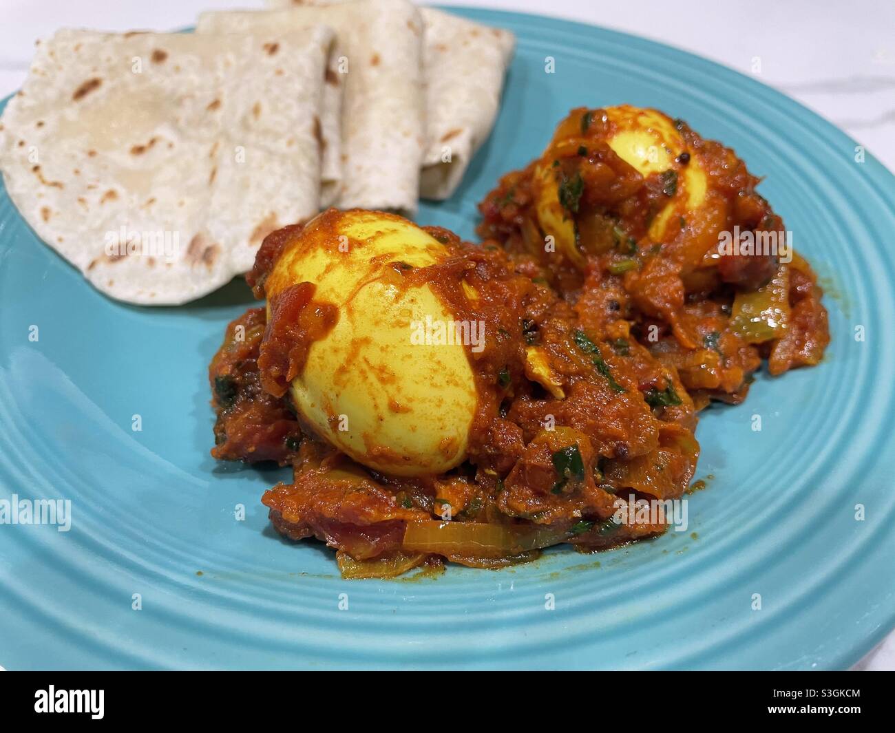 Egg curry with roti Stock Photo Alamy