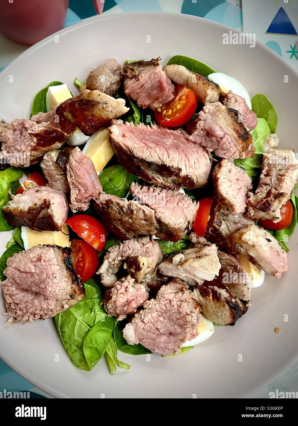 Keto lamb and egg spinach salad - Smartphone Captured Stock Image