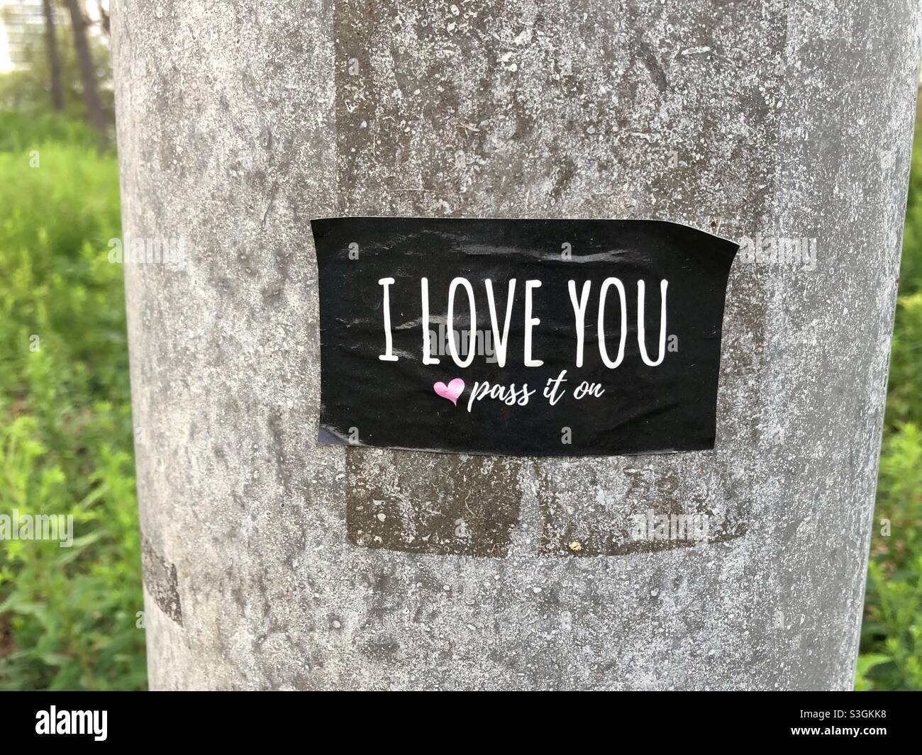 An I love you sticker pasted on a pole. - Smartphone Captured Stock Image