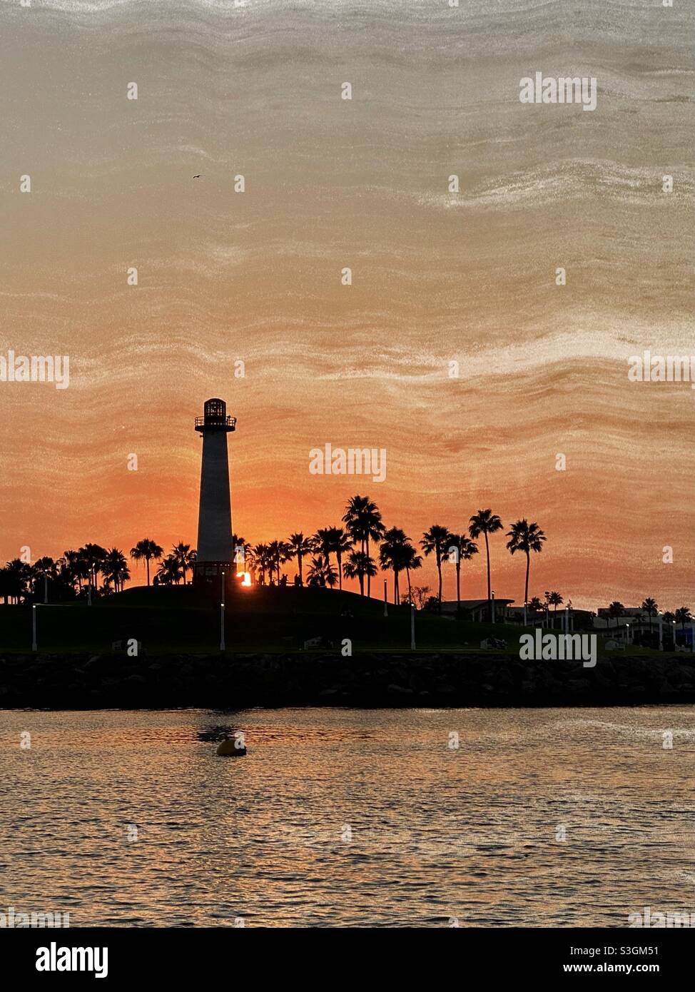 Sunset at rainbow harbor lighthouse in Long Beach California Stock Photo