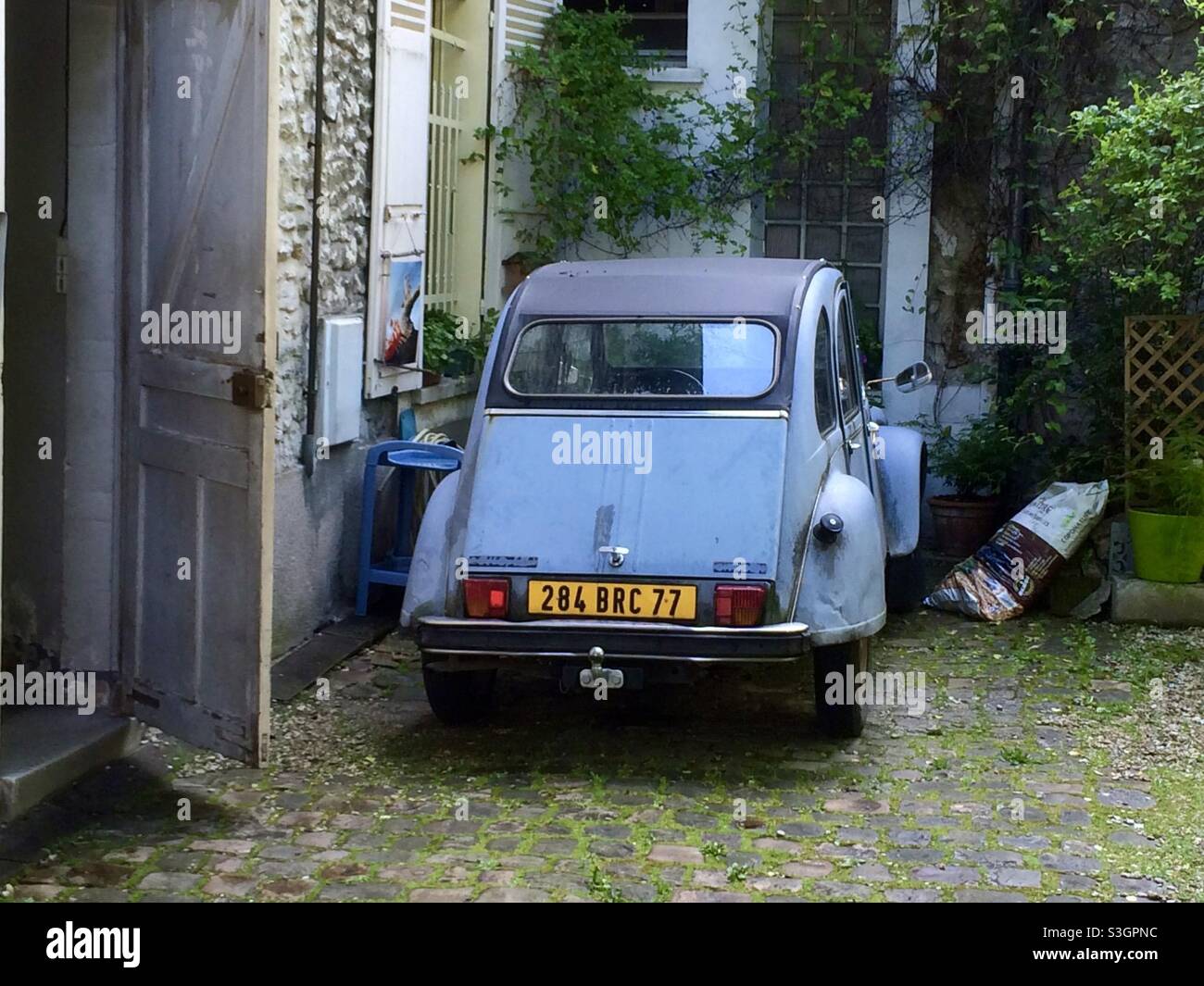 Vintage Citroen parked at a medieval house in Provins, France - Smartphone Captured Stock Image