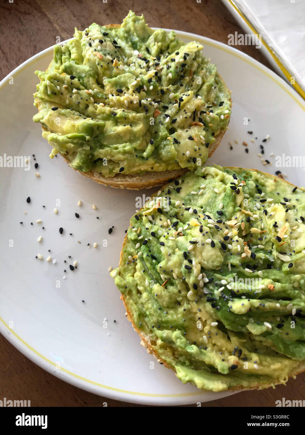 Best avo toasted bagel in town. Stock Photo