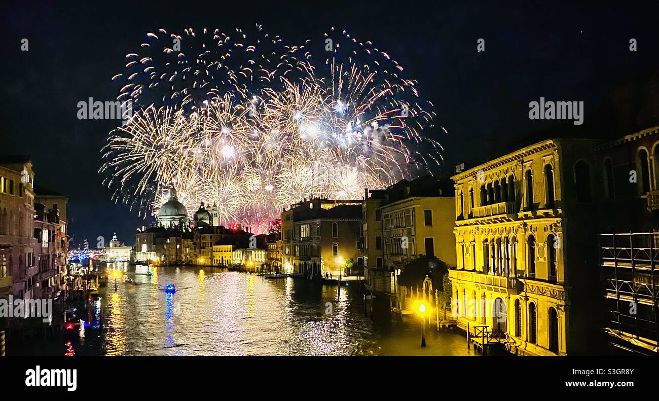 Fireworks in the 2021 Venice Redentore Festival (Feast of the Redeemer), a popular 400 year old festival that celebrated the end of the plague in the 16th century. Venice, Italy - Smartphone Captured Stock Image