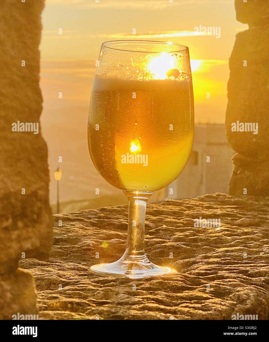 Glass of beer in the sunset in the fortress of San Marino - Smartphone Captured Stock Image