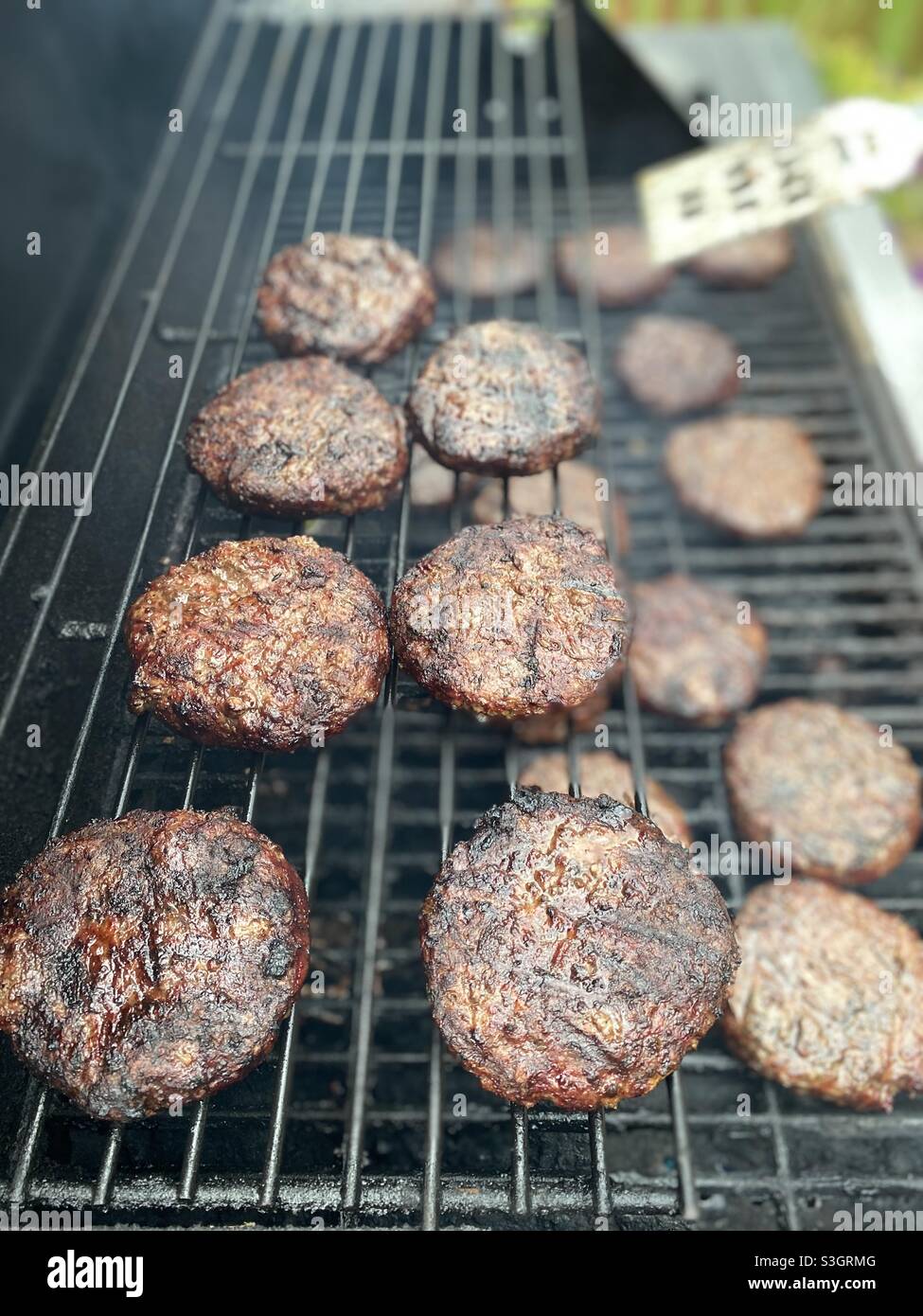 Grilling hamburgers. - Smartphone Captured Stock Image