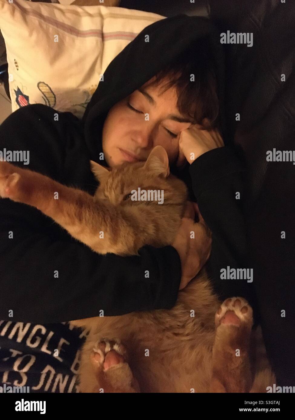 Girl relaxing with a red cat - Smartphone Captured Stock Image