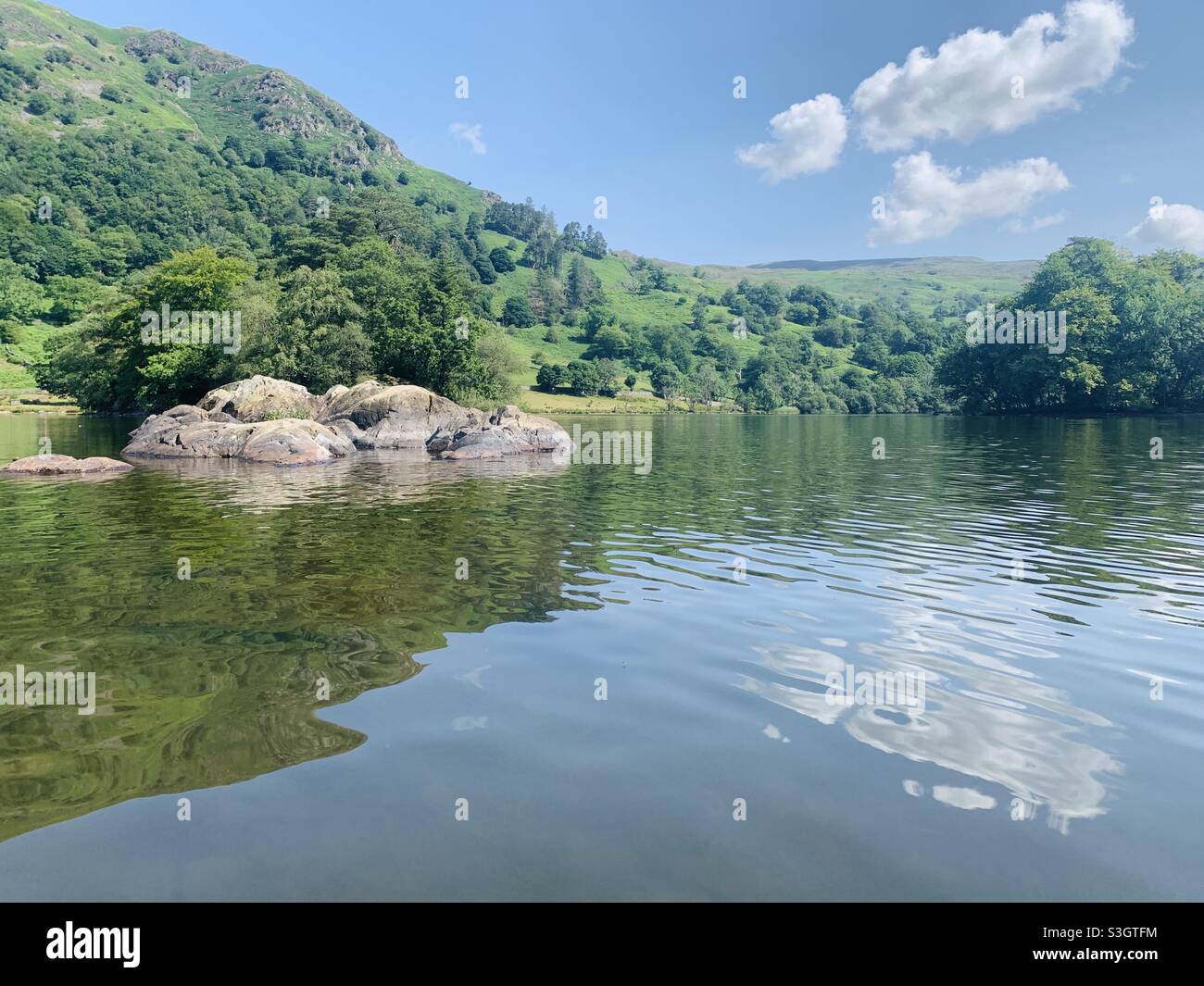 Reflection across the lake at rydal water Stock Photo