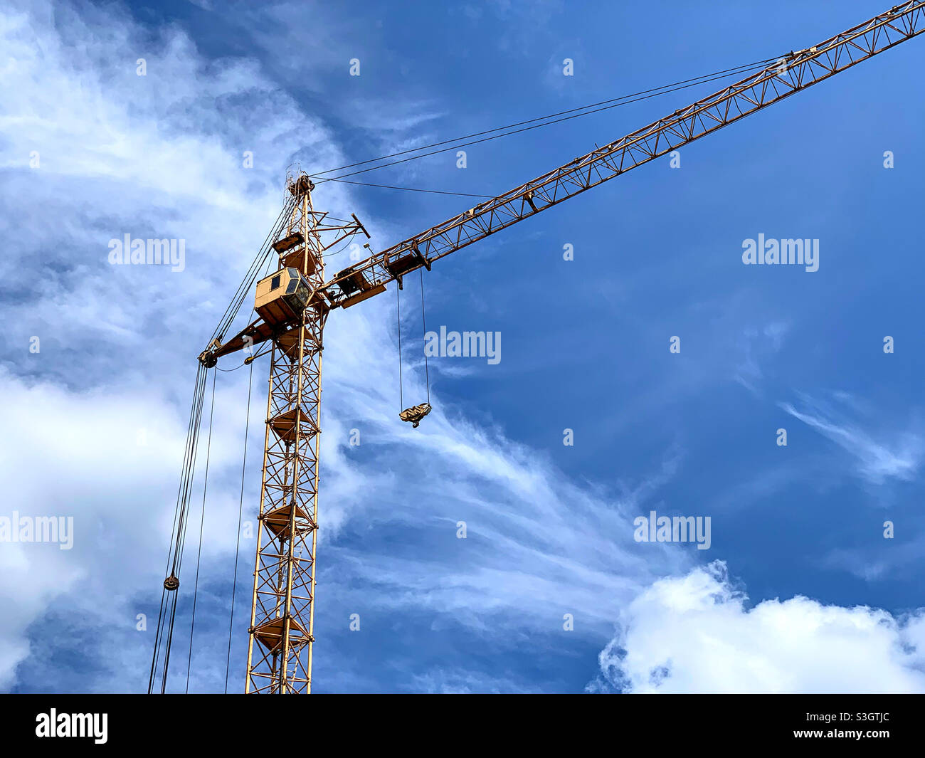 high crane on the background of the cloudy sky - Smartphone Captured Stock Image