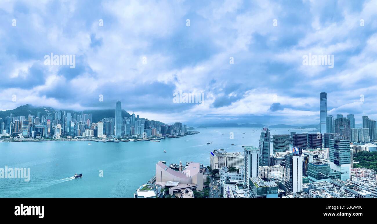 A view of Victoria harbour , HK island and the Kowloon waterfront in Hong Kong. Stock Photo