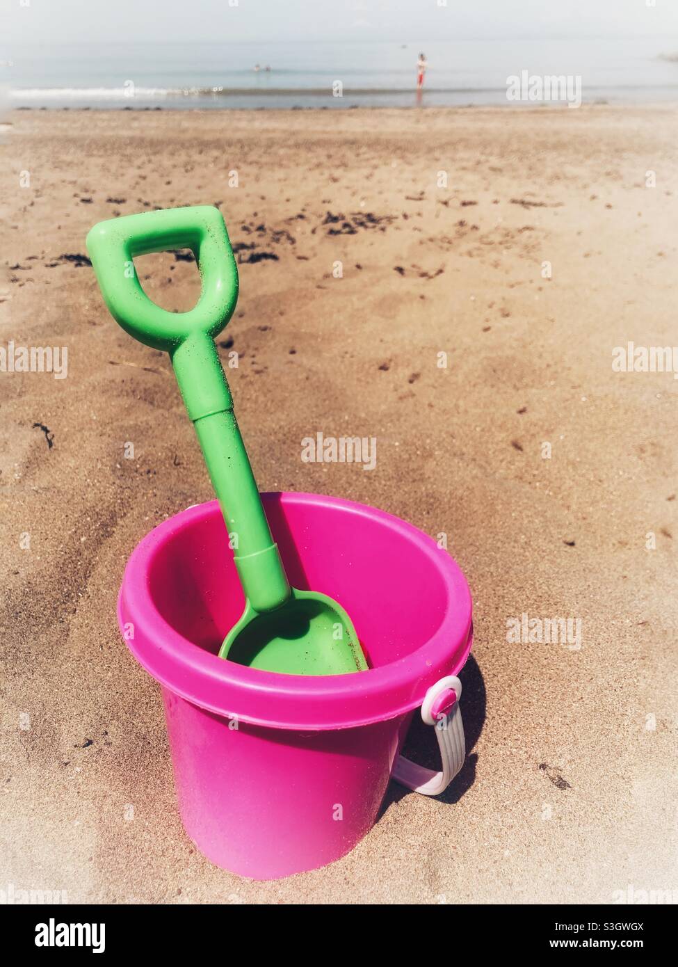Bucket and spade on sandy Minehead beach, Devon Stock Photo