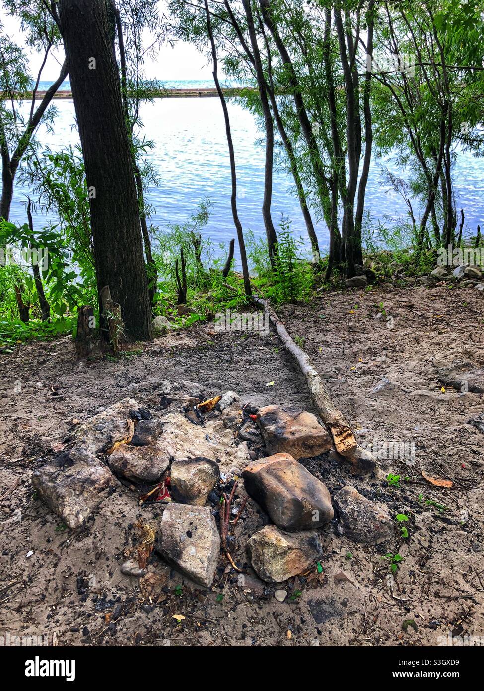A fire pit on the shores of Lake Ontario in Toronto, Canada. - Smartphone Captured Stock Image