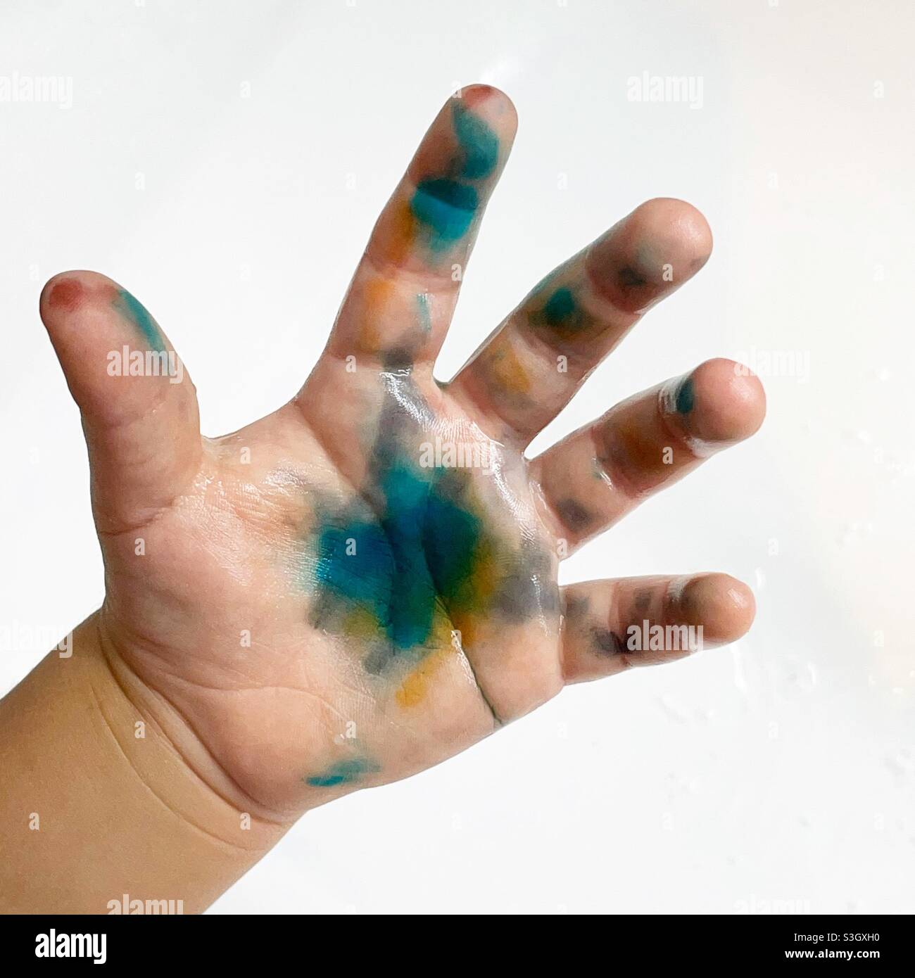 Toddler hand stained with colours - Smartphone Captured Stock Image