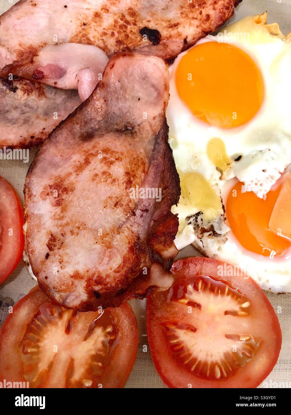 Bacon and eggs with tomatoes - Smartphone Captured Stock Image
