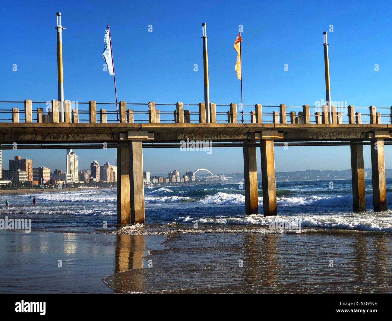 Moses Mabhida Stadium visible from UShaka Beach in Durban, South Africa Stock Photo
