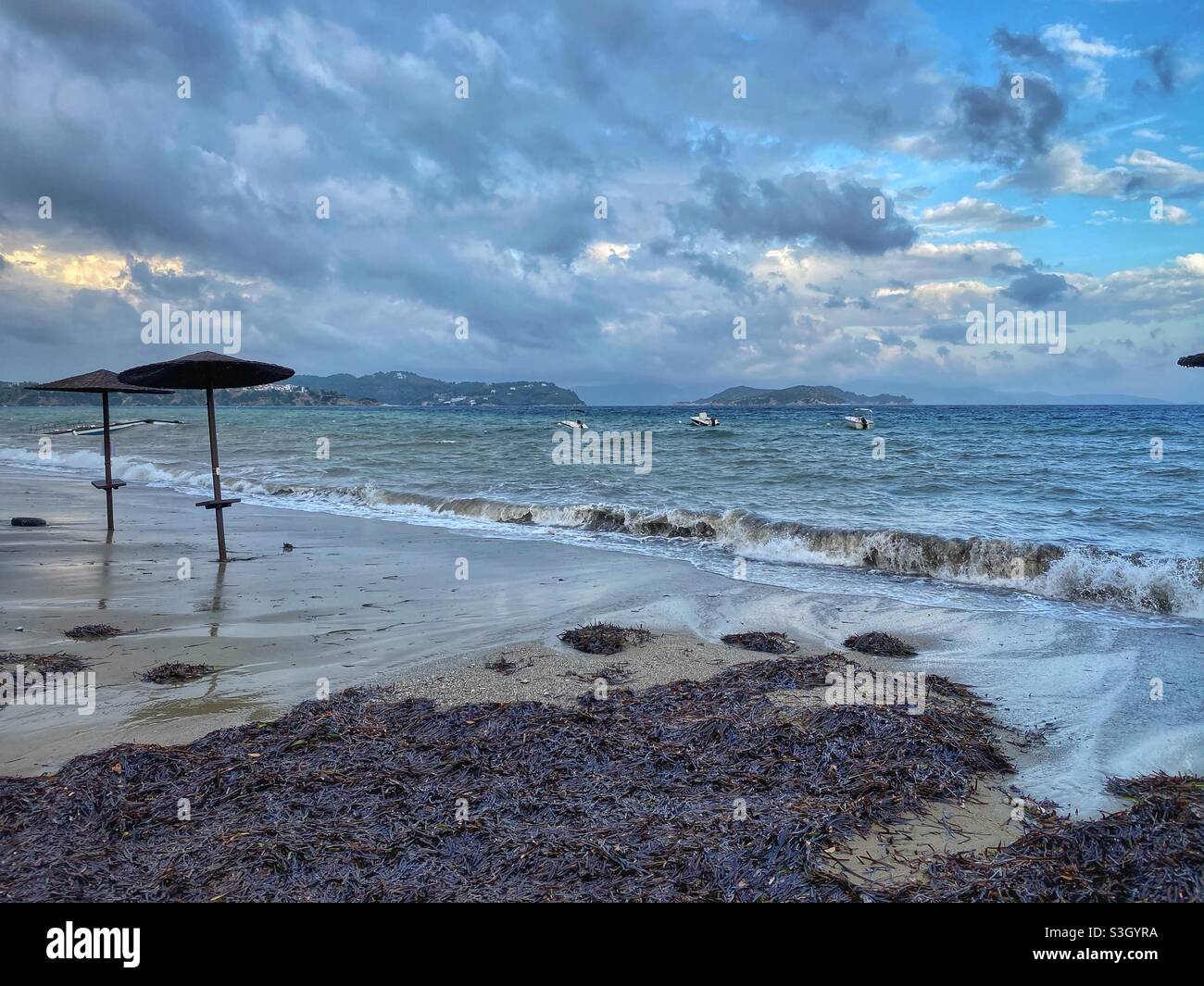 Stormy cloudy day on Vassilias beach on Skiathos island in Greece. - Smartphone Captured Stock Image