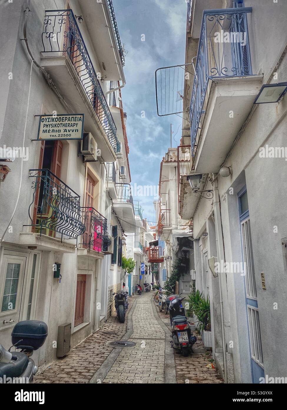 Picturesque narrow street in Skiathos town, Greece. - Smartphone Captured Stock Image