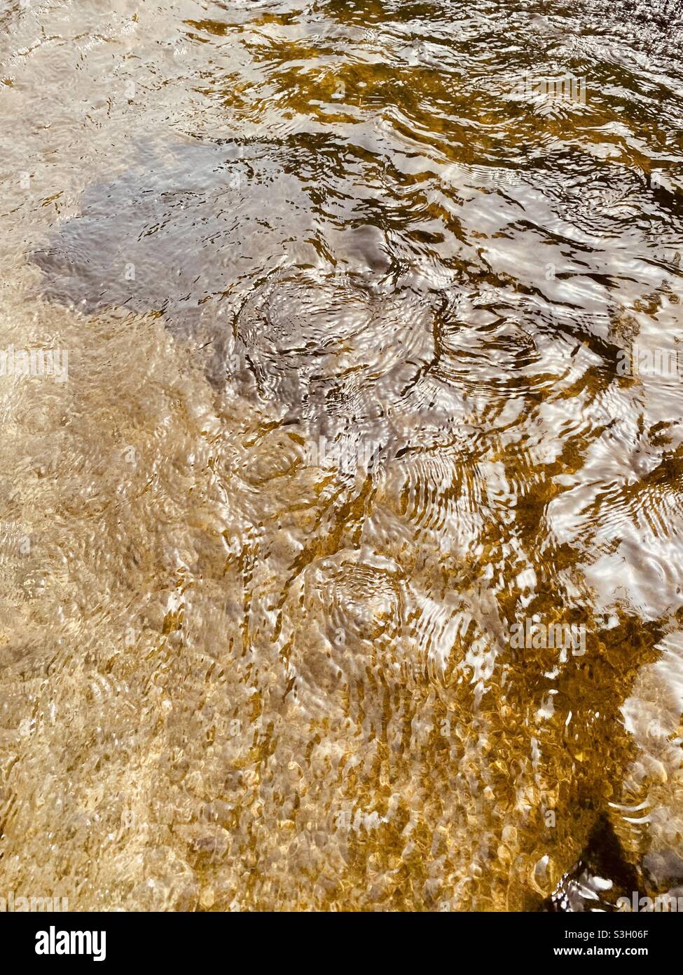 Ripples on flowing water Stock Photo