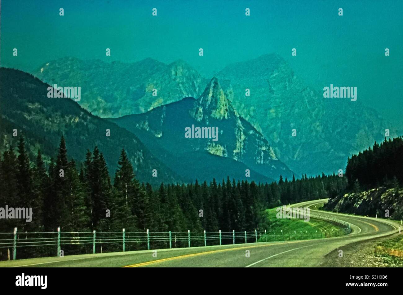 Smoky day in the Rockies, forest fires, global warming , winding, mountain road - Smartphone Captured Stock Image