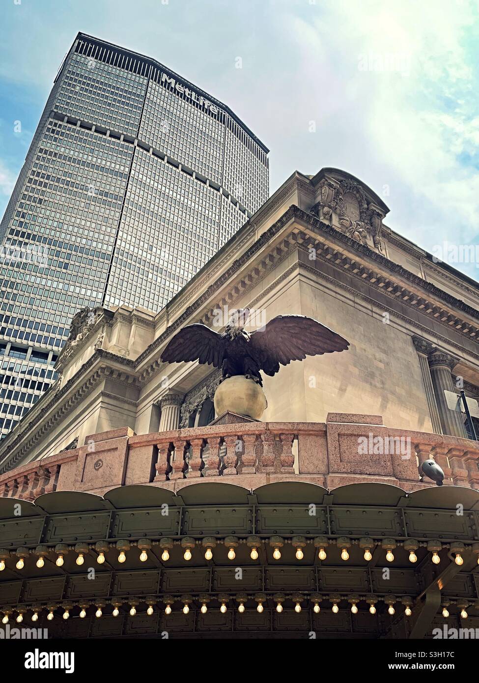 Huge cast iron eagle statue stands guard of the Vanderbilt entrance to Grand Central terminal, 42nd St., NYC, USA - Smartphone Captured Stock Image