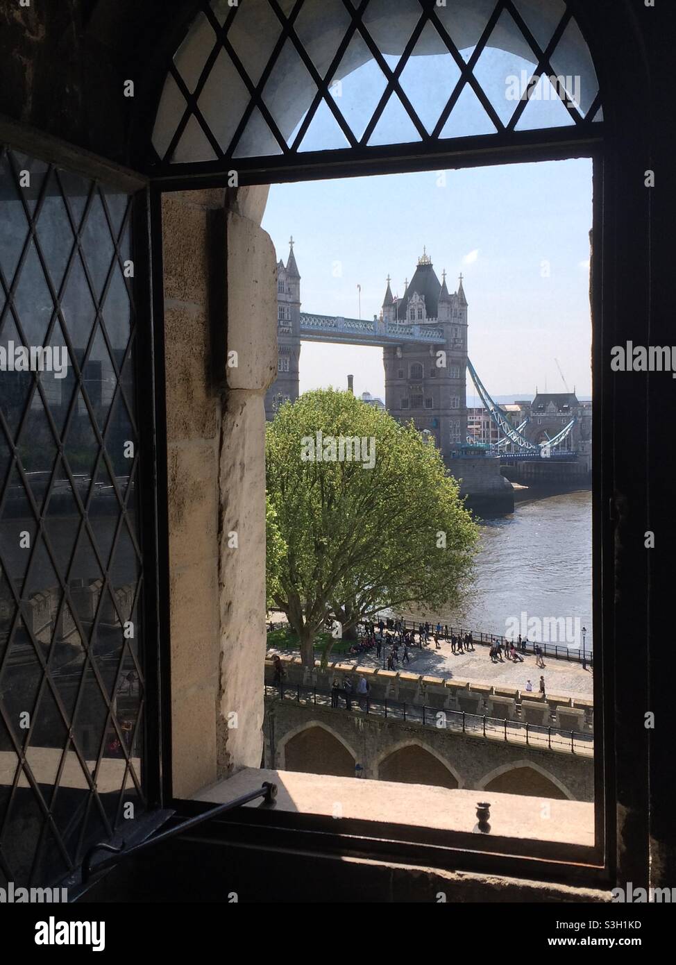 Tower bridge viewed through window of the Tower of London - Smartphone Captured Stock Image