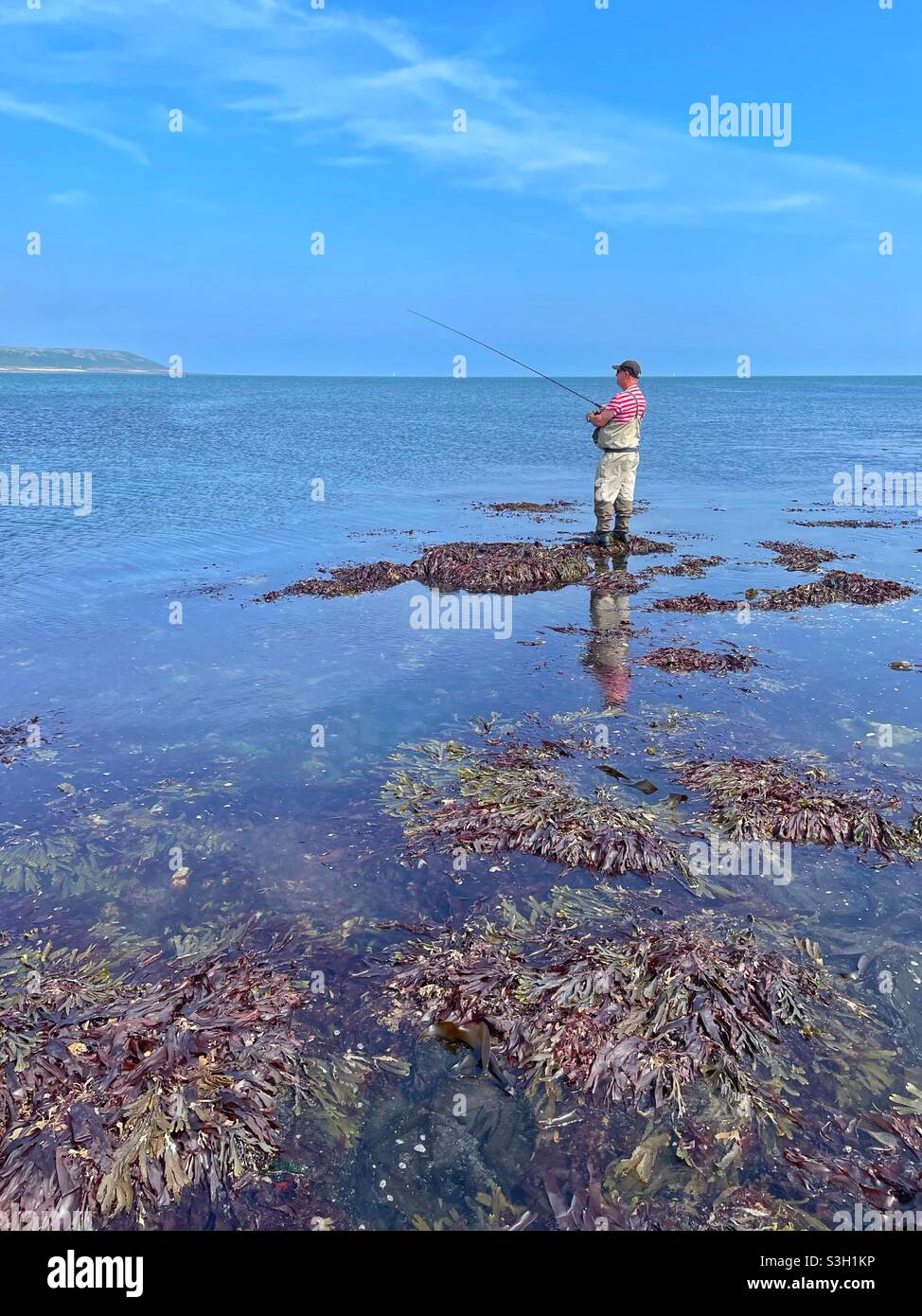Sea angler at Port Eynon, Gower peninsula, South Wales, July. - Smartphone Captured Stock Image