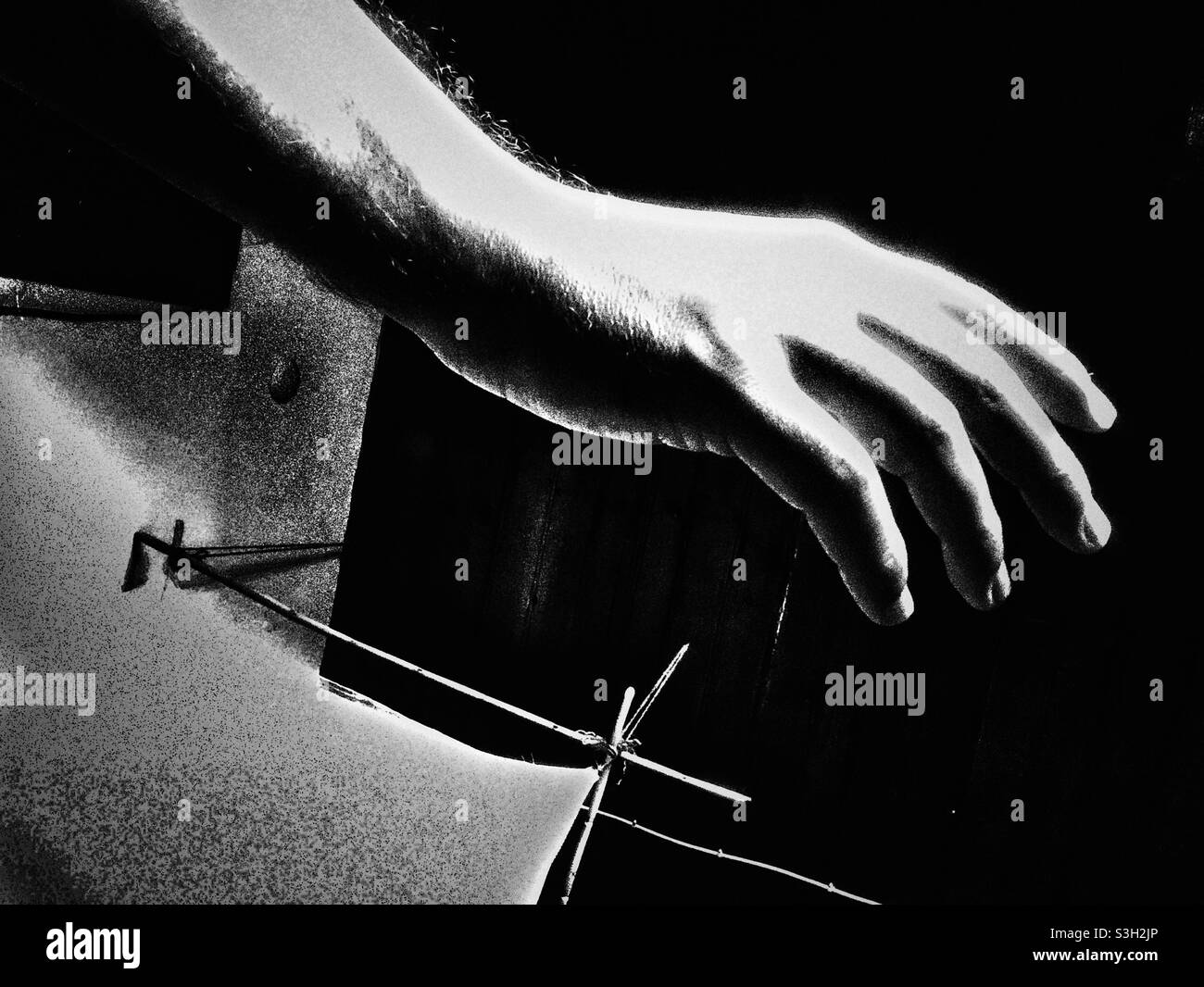 Dramatic black and white  image of a hand - Smartphone Captured Stock Image