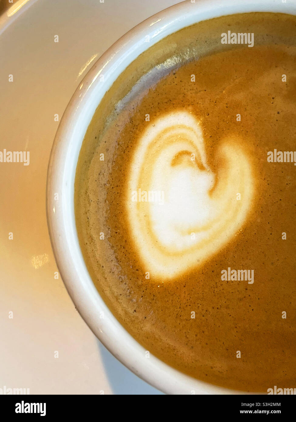 Heart shape in cup of coffee. Close view. - Smartphone Captured Stock Image
