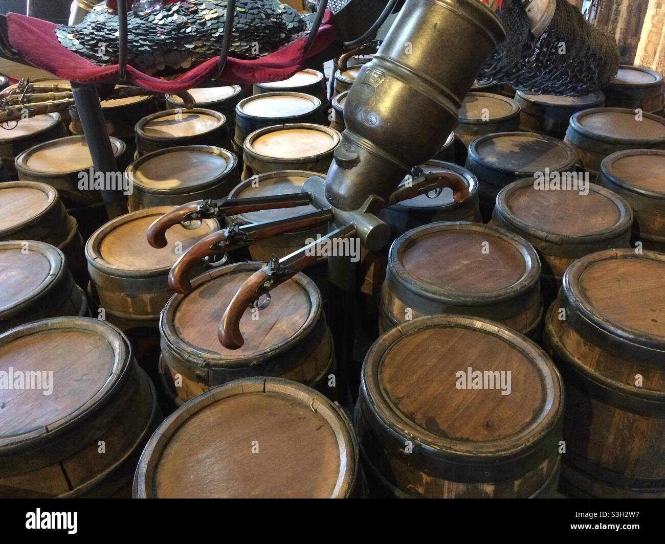 Wine barrels with unique brass spigots made with antique revolvers