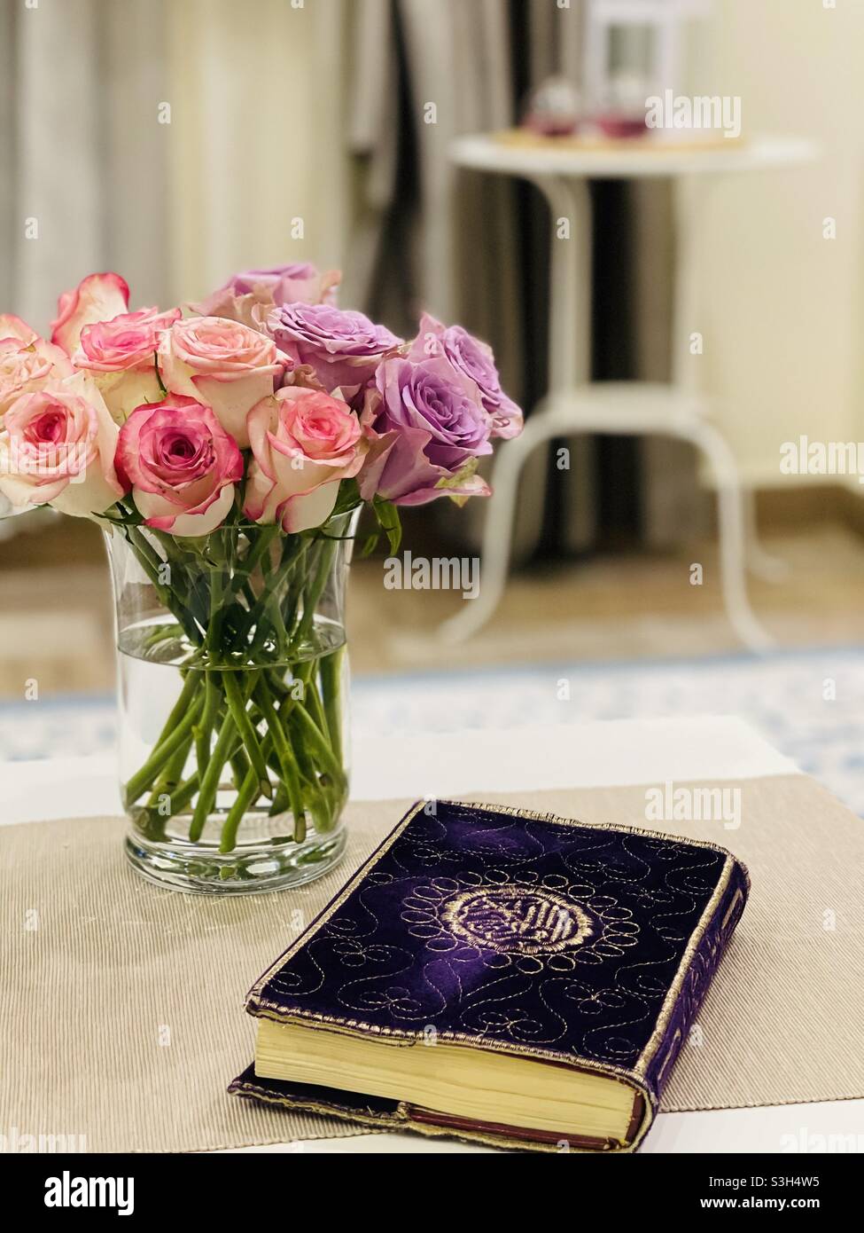 Holly quran and beauty flowers in my home  Stock Photo - Alamy