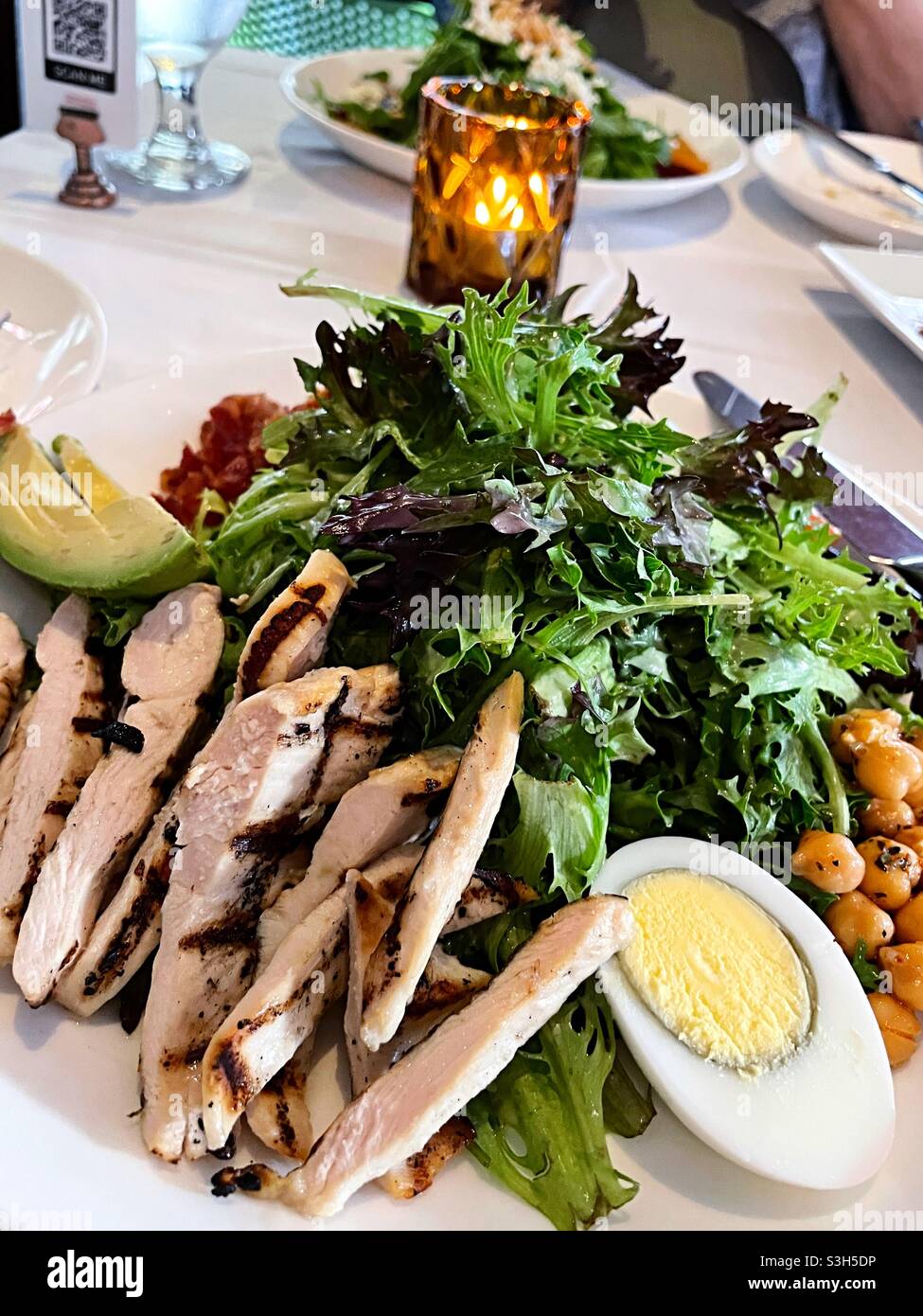 Close up of a Cobb salad served at a white tablecloth restaurant, NYC, USA - Smartphone Captured Stock Image