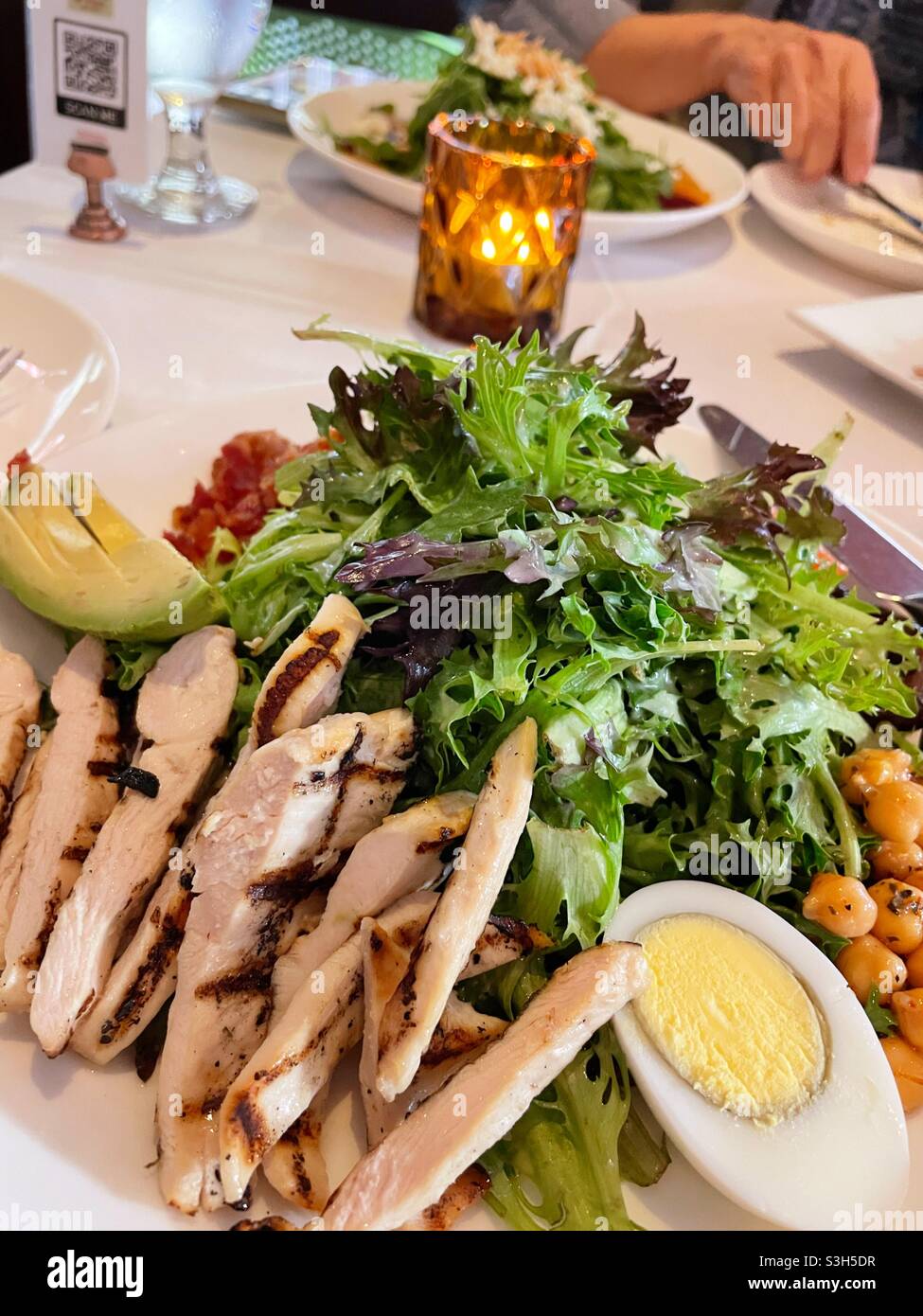 Close up of a Cobb salad served at a white tablecloth restaurant, NYC, USA - Smartphone Captured Stock Image