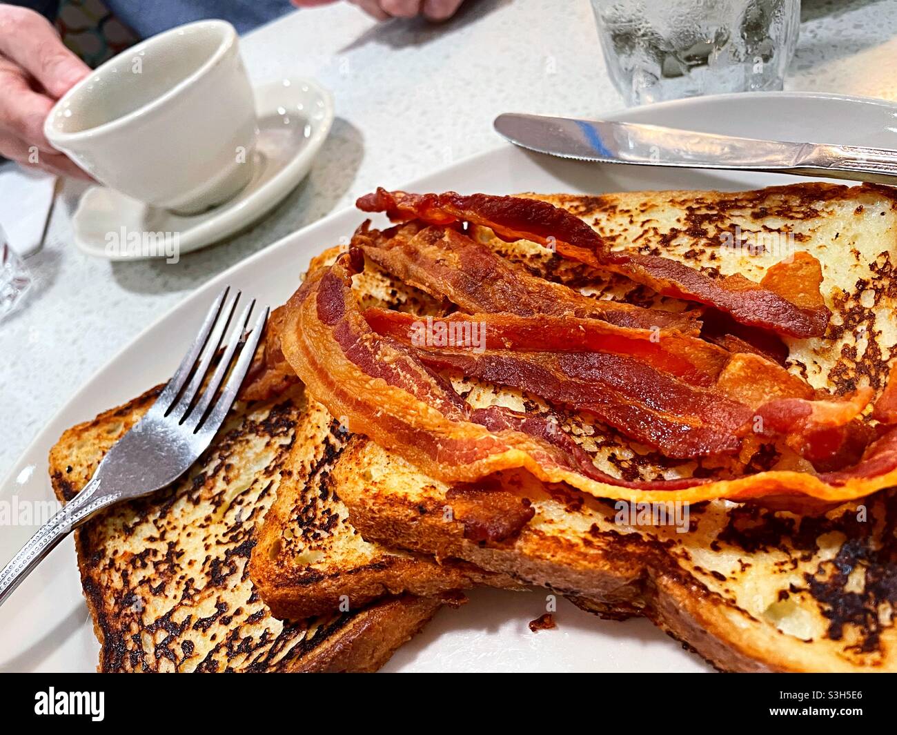 Close up of a diner restaurant breakfast of bacon and French toast, USA - Smartphone Captured Stock Image