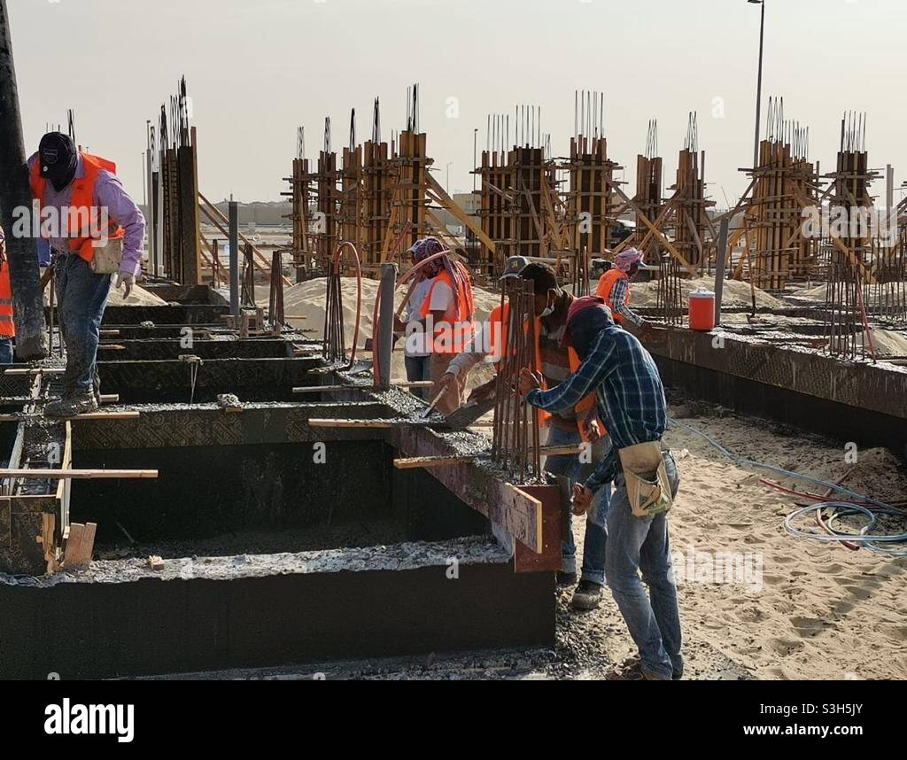Labors working at construction site Stock Photo