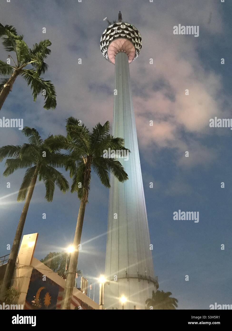 Nighttime view of Menara Kuala Lumpur Tower in Kuala Lumpur, Malaysia - Smartphone Captured Stock Image