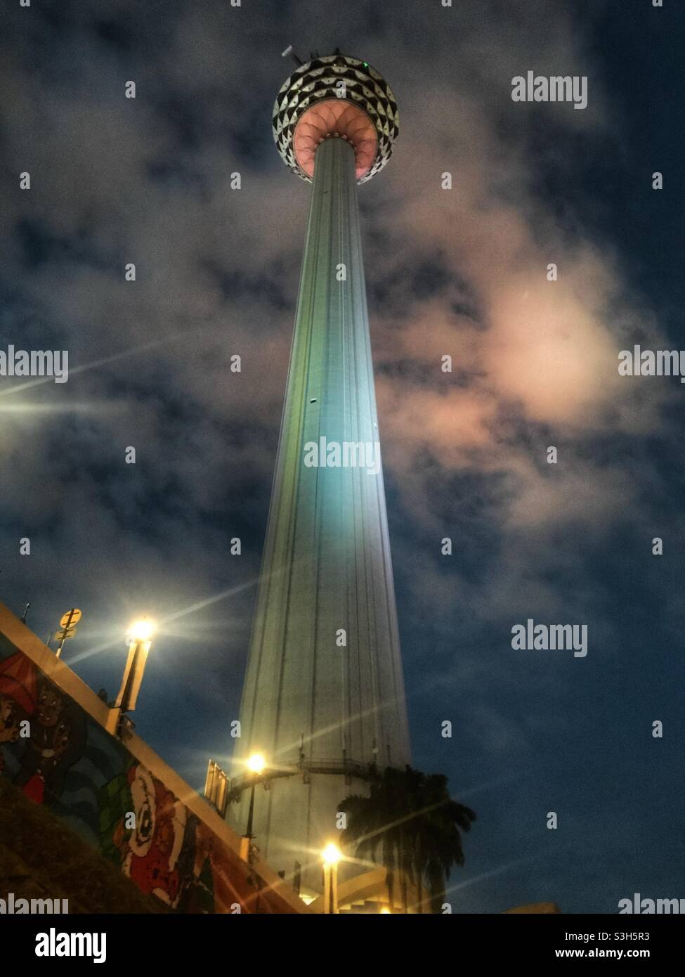 Low angle night view of the Menara Kuala Lumpur Tower in Kuala Lumpur, Malaysia - Smartphone Captured Stock Image