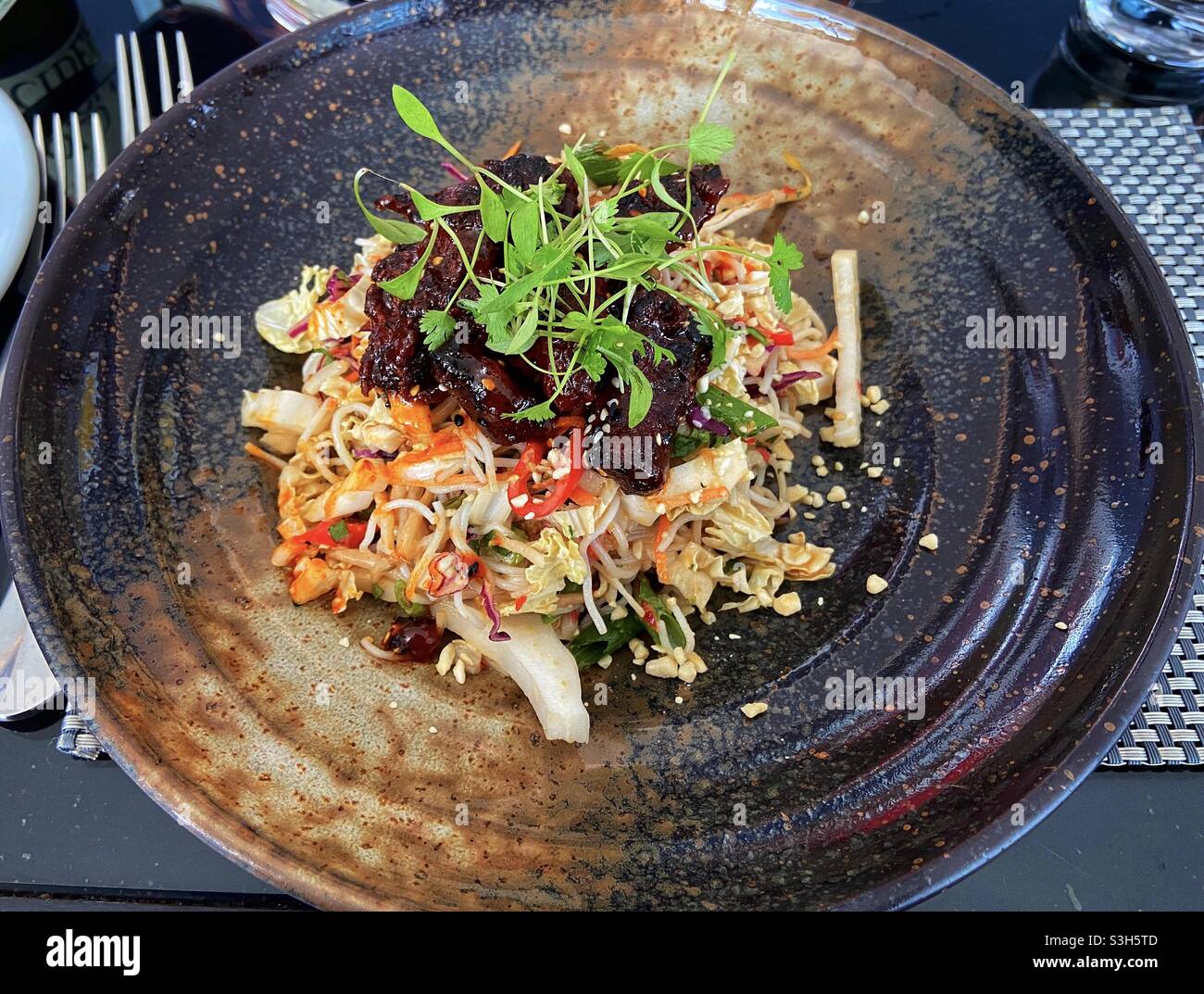 Thai sticky beef and noodle salad. - Smartphone Captured Stock Image