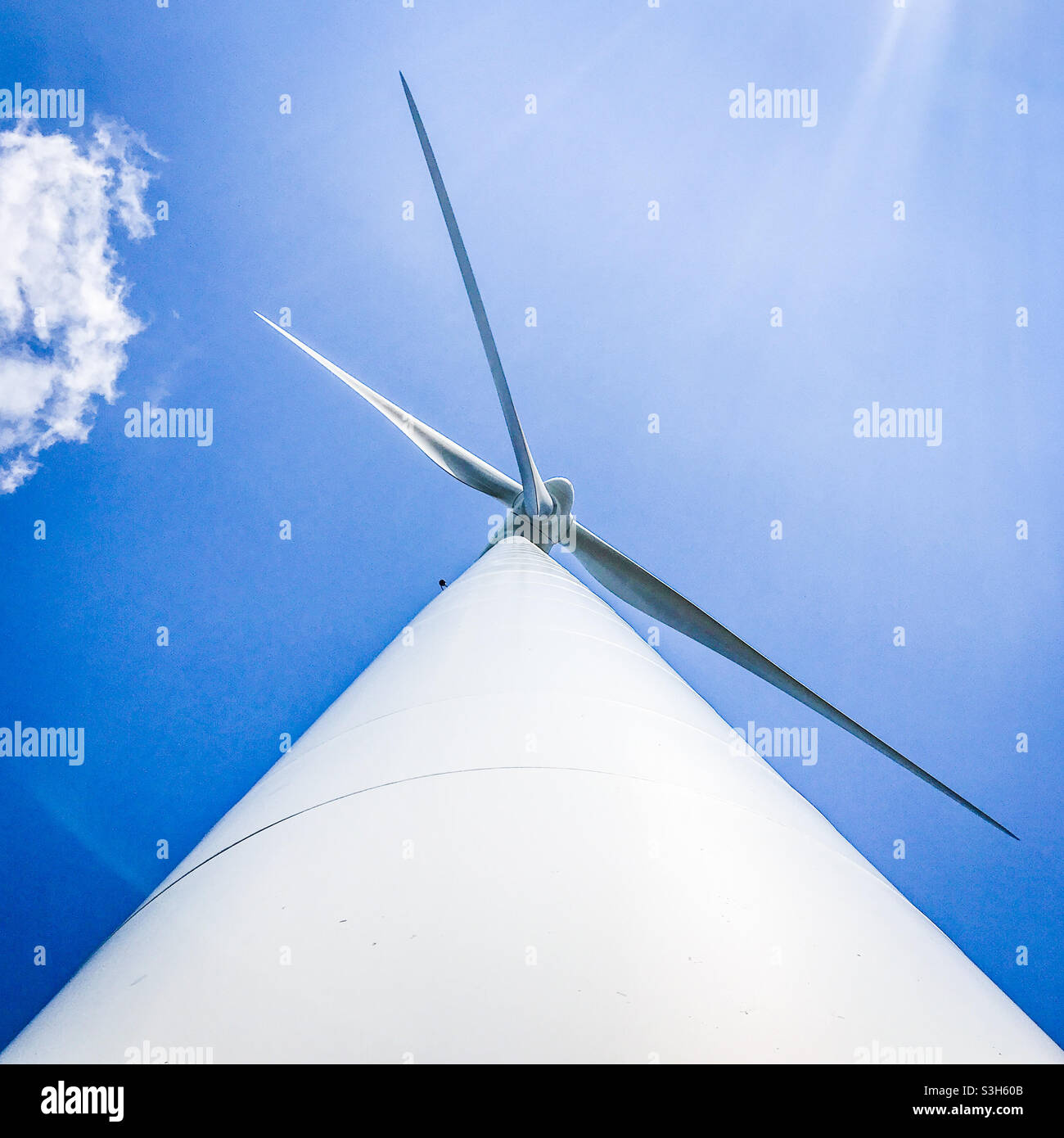 Low angle wide angle view of a wind turbine Stock Photo