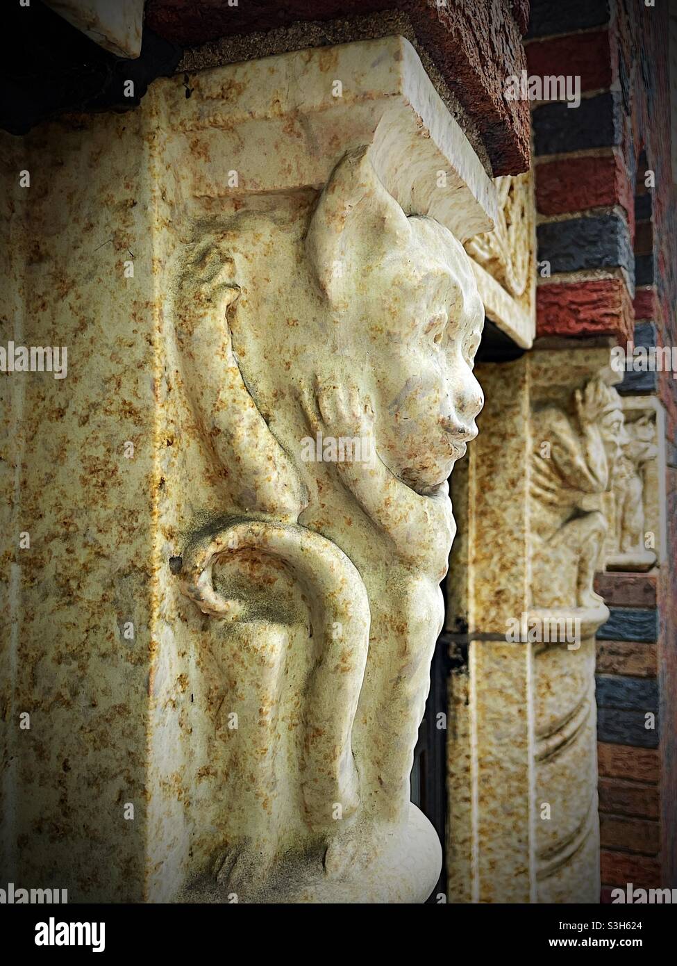 Stone carving on the front of The Renwick Koma a boutique hotel in Murray Hill, NYC, USA - Smartphone Captured Stock Image