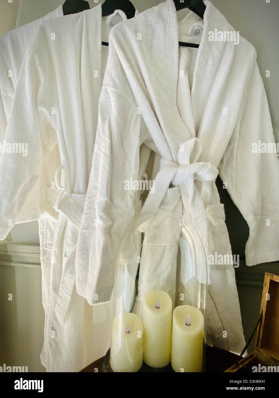 Robes and candles at a spa Stock Photo