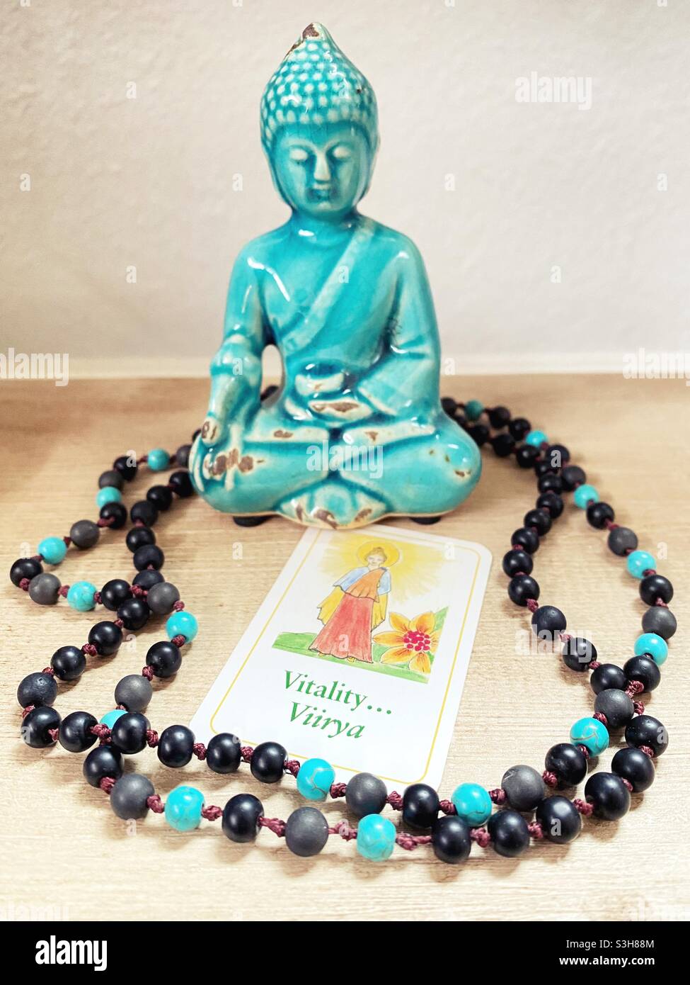 A Buddha card with the word 'vitality'. Stock Photo