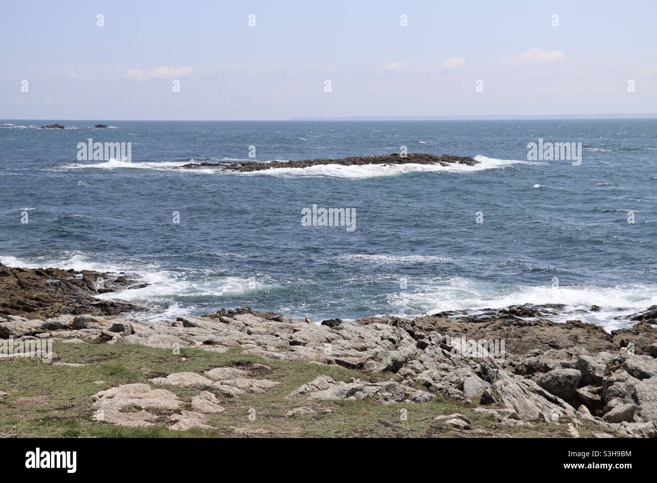 Waves and rocks at the wild coast of Quiberon in Brittany, France - Smartphone Captured Stock Image