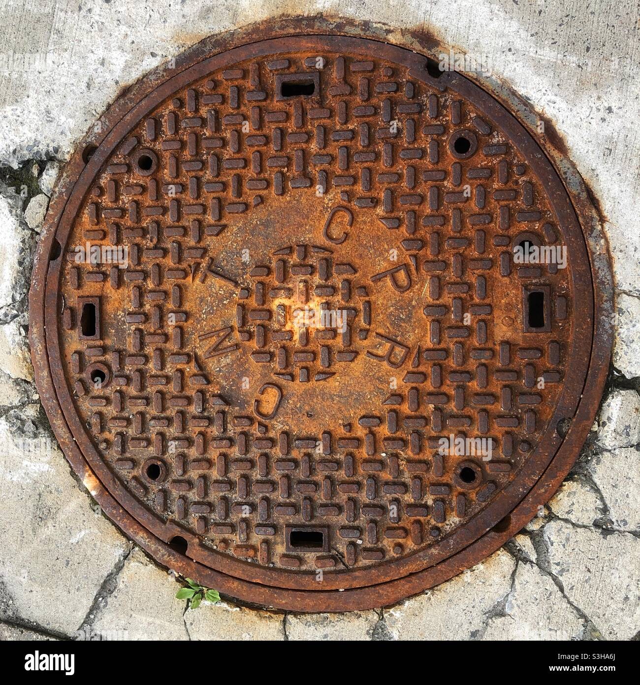 Manhole cover CNT CPR, Ottawa, Ontario, Canada, August 2021 - Smartphone Captured Stock Image