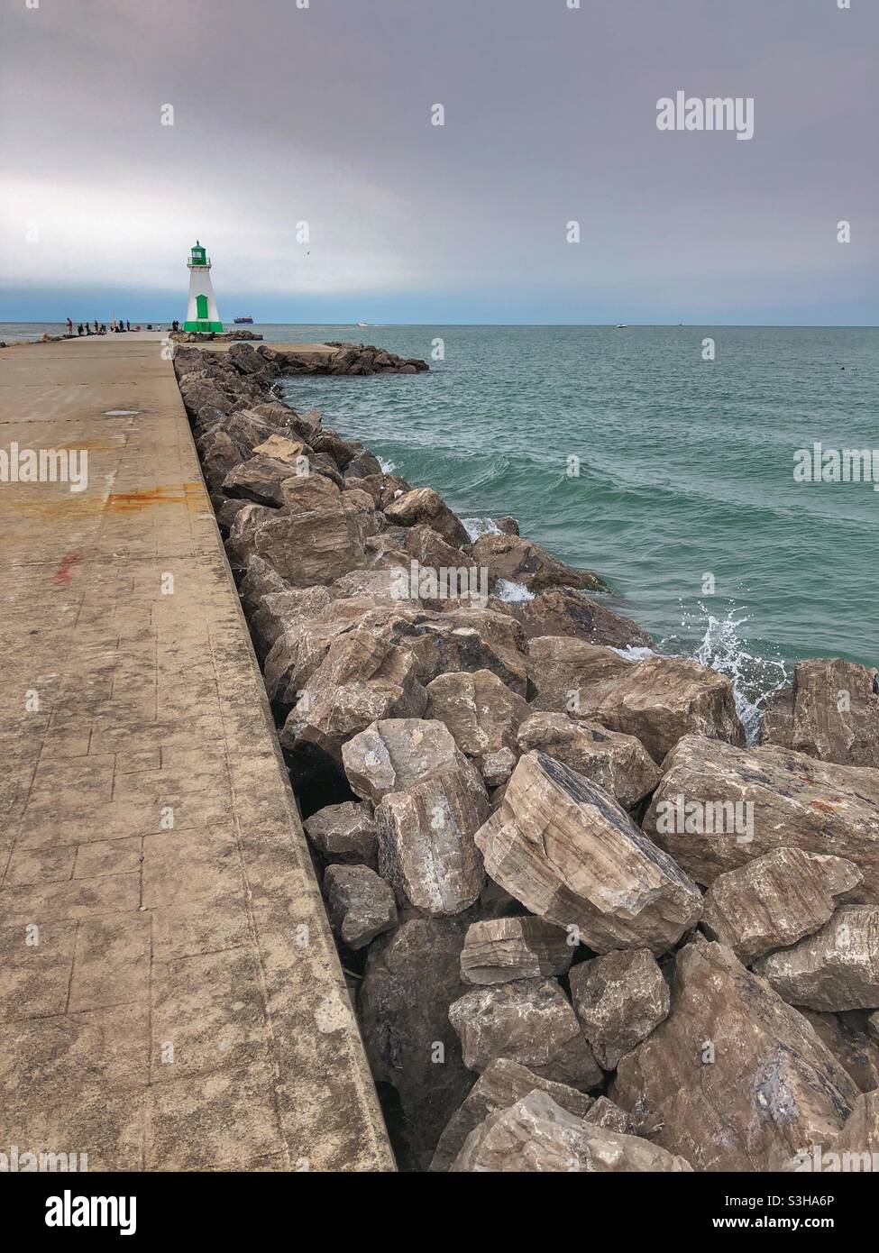 The Port Dalhousie pier on Lake Ontario on an overcast day. - Smartphone Captured Stock Image