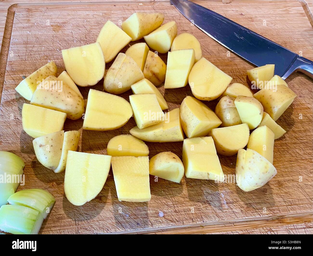 Chopped potatoes on a cutting board - Smartphone Captured Stock Image