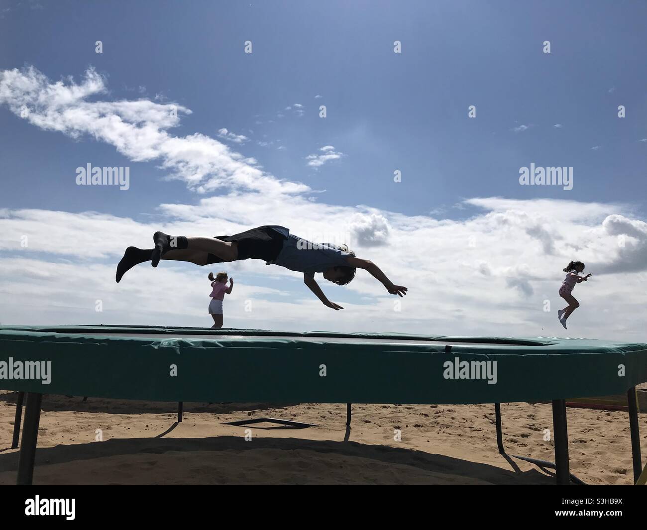 Children trampolining at Ramsgate beach Kent UK Stock Photo